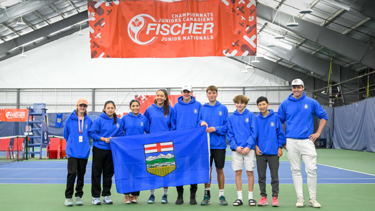 Team Alberta U18 team photograph with Alberta flag.