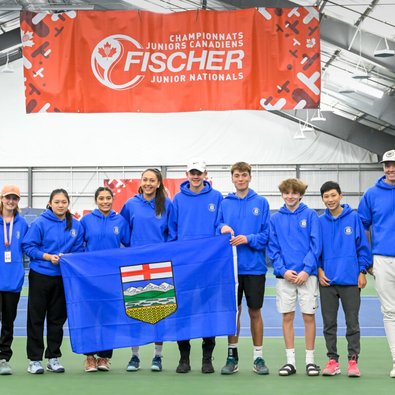 Team Alberta U18 team photograph with Alberta flag.
