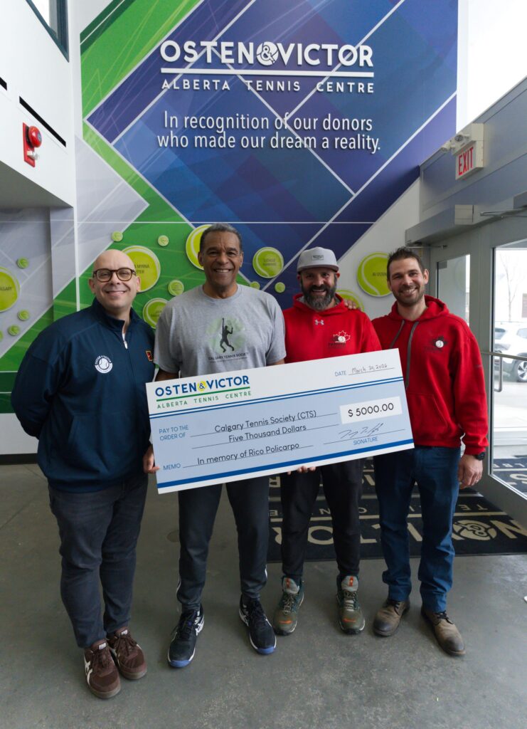 Cheque presentation with Danny Da Costa, Patrick Thomas, and the Policarpo brothers, Alex and Chris