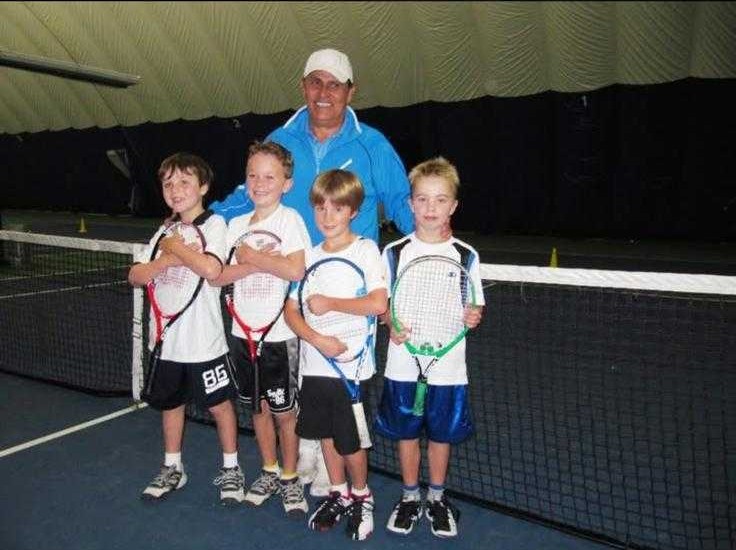 Rico Policarpo on court with junior players