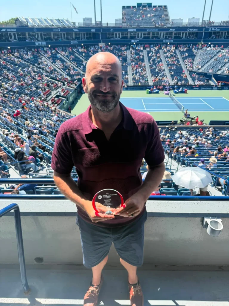 Coach Robert Senic accepting the Gary Caron TPA Scholarship Award at the National Bank Open in Toronto