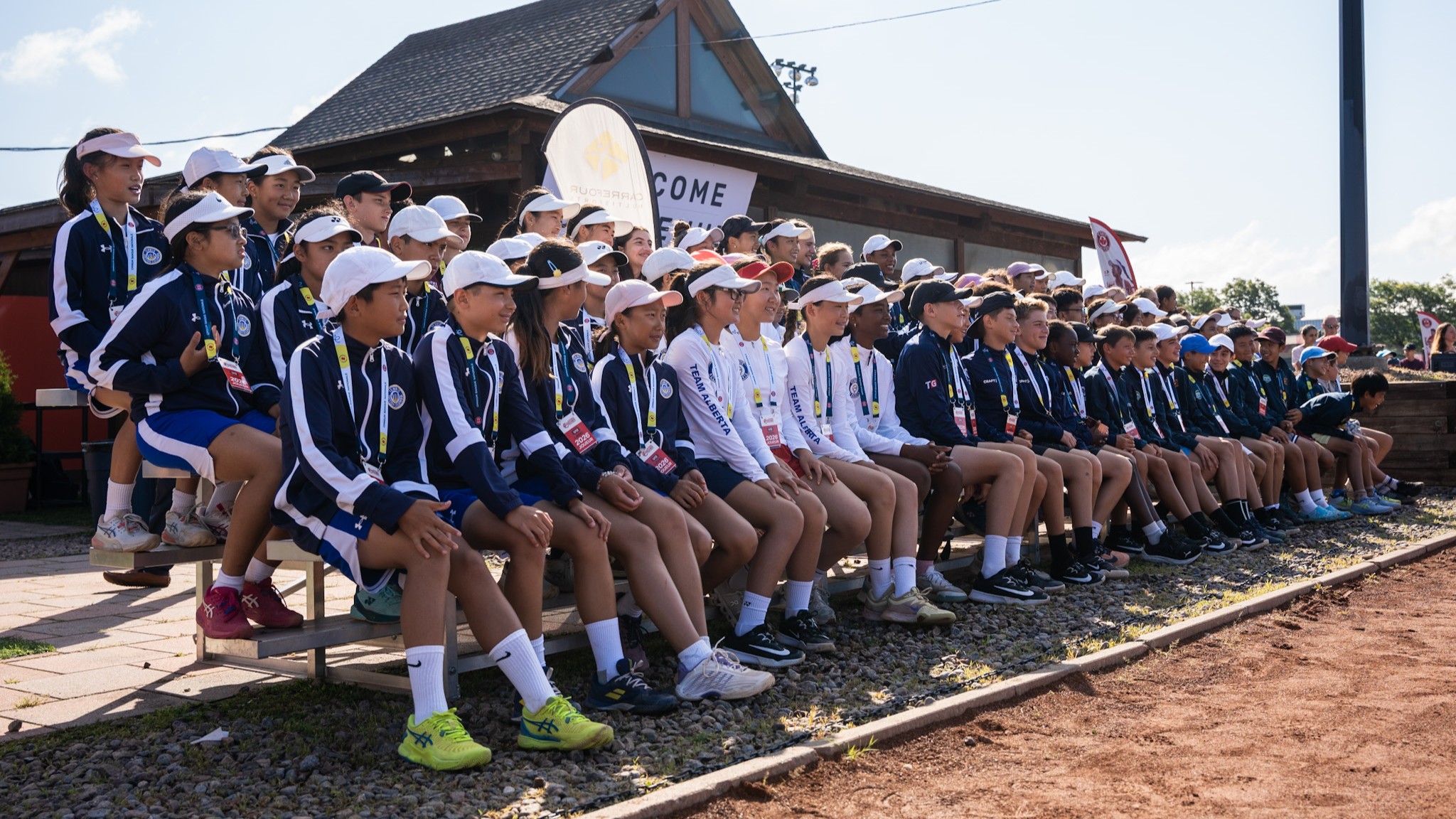 Junior Nationals athletes pose for group photo at opening ceremonies.